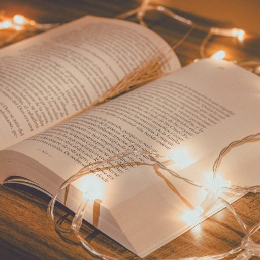 open book with a light guirland