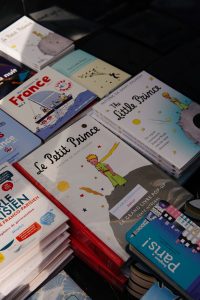 a pile of children's books sitting on top of a table